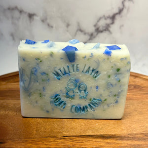 white soap bar with blue and green confetti inside
