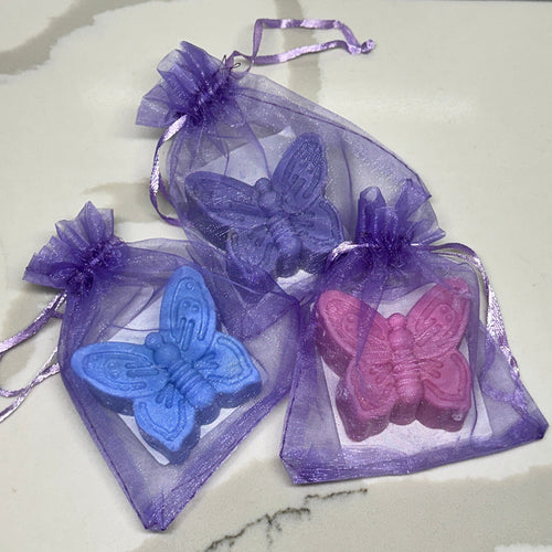 2 butterfly soap in a purple organza bag. One pink soap, one blue soap, one purple soap